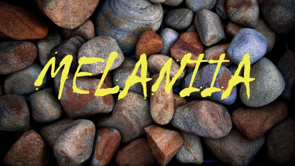 Название MELANIIA на фоне скалы 